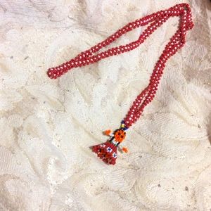 Beaded doll necklace
